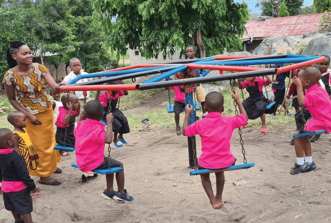 Children playing in outdoor learning environment