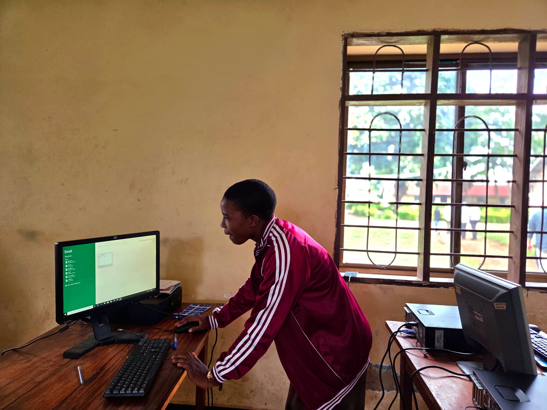 Students learning computer skills at an FDC